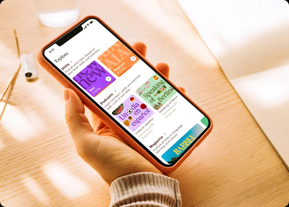 Babbel app workspace showing the 'Explore' screen with language units and podcasts on a modern mobile interface.