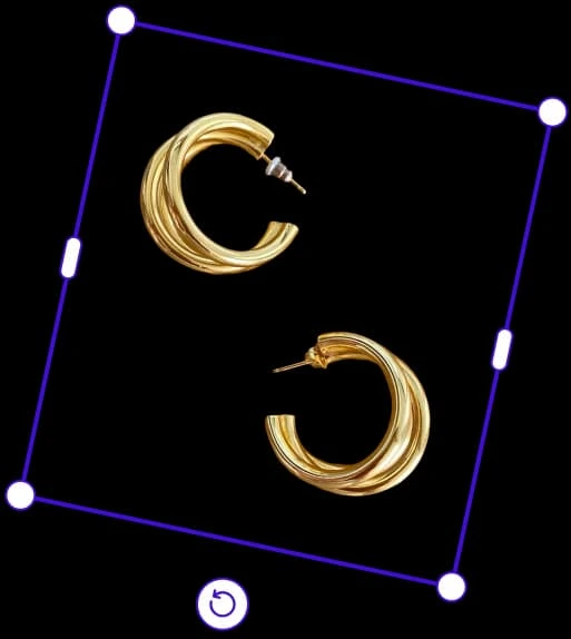 Photoroom workspace showing golden hoop earrings selected for editing with a dark-themed interface.
