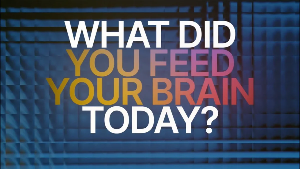 recall conceptual graphic asking 'What did you feed your brain today?' with bold, multi-colored typography on a dark, patterned background.