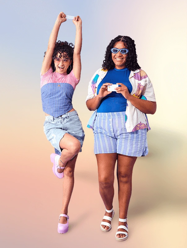 remove-bg output-sample showing two diverse women joyfully posing against a vibrant gradient background, demonstrating successful background replacement.